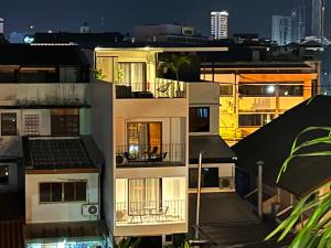 a view of a building at night at ONE LODGE Pattaya in Pattaya Central
