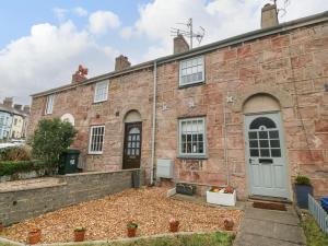 an exterior view of a brick building at Llety Bach in Caernarfon