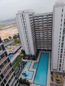 an aerial view of a hotel with two large buildings at Swiss Home Horizon Suite 2 in Sepang