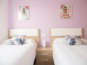 Postel nebo postele na pokoji v ubytování Villa Joan