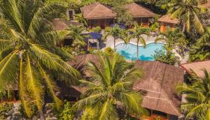 an aerial view of a resort with palm trees at Magic Island Dive Resort in Moalboal