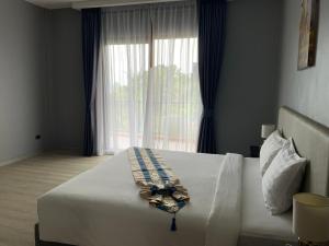 Postel nebo postele na pokoji v ubytování Aonang Inn