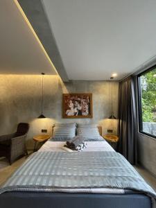 a bedroom with a large bed and two tables at DJipangan Home in Bantul