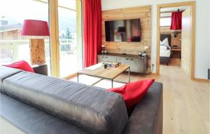 a living room with a leather couch and a table at 1 Bedroom Nice Apartment In Flachau in Flachau