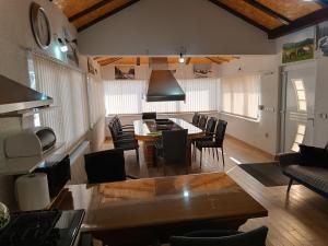 a living room with a table and chairs at Apartman Kaja in Kupres