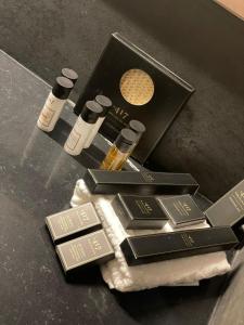 a pile of products on a table with a box at H34 Boutique Hotel & Spa by the sea of Nahariya in Nahariyya
