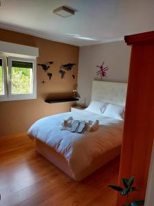 מיטה או מיטות בחדר ב-Las Tres Mimosas