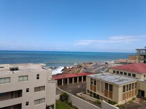 a view of the ocean from a building at Santorini 206B -Margate RSA in Margate