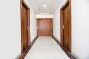 an empty corridor with two doors at FabExpress Comfort Stay I in Bhopal