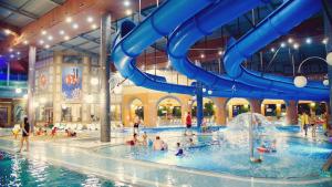 a water park with people playing in the water at Art Music Loft Białystok in Białystok
