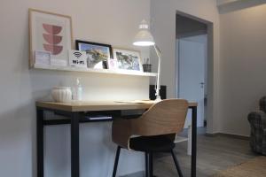 a desk with a chair in a room at City Center Apartment 1 in Alexandroupoli