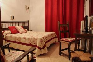 Ένα ή περισσότερα κρεβάτια σε δωμάτιο στο Hotel Garona