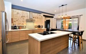 a kitchen with a sink and a counter top at Stunning Home In Beaucaire With Wifi in Beaucaire