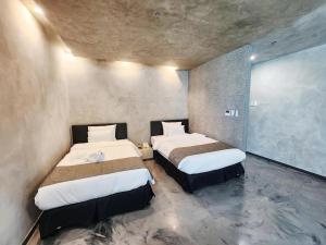 Letto o letti in una camera di Cube9 Resort & Spa 큐브9 리조트 & 스파