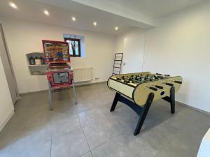 a room with a chess board and a video game at Le gîte d'Hayen in Sprimont