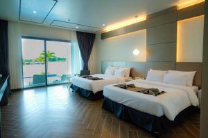 Letto o letti in una camera di Cube9 Resort & Spa 큐브9 리조트 & 스파