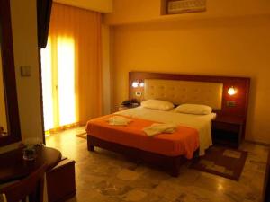 Postel nebo postele na pokoji v ubytování Hotel Filoxenia