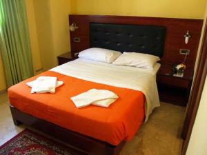 Postel nebo postele na pokoji v ubytování Hotel Filoxenia