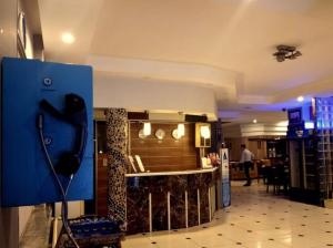 a kitchen with a blue island in a room at Hotel Anibal in Gebze