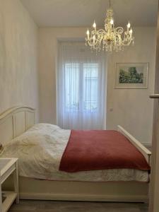 Posteľ alebo postele v izbe v ubytovaní Cannes Studio situé dans la résidence Gallia Historique