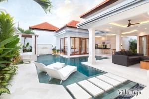 a villa with a swimming pool in a villa at Villa Mia Seminyak - Boutique Villas in Seminyak