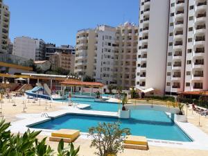 a large swimming pool in the middle of a building at CPR SolNascente in Portimão