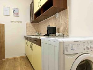 A kitchen or kitchenette at Simcity I free parking 24h self check-in