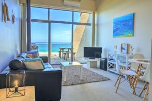 a living room with a view of the ocean at Ocean View Apartments at Whitecrest Great Ocean Road Resort in Apollo Bay