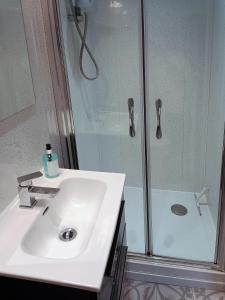 a bathroom with a sink and a shower at The Tides in Cleethorpes