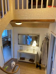 a bathroom with a sink and a dog in a room at 200 m til havet - fri adgang til svømmehal in Thyborøn +26 photos