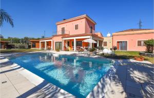 a swimming pool in front of a house at Beautiful Home In Acireale With Wifi in Acireale