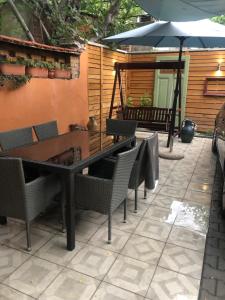 A patio or other outdoor area at Diva Garden Apartment