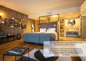 Postel nebo postele na pokoji v ubytování PAPA RHEIN - Hotel & Spa