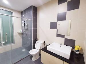 a bathroom with a toilet and a sink and a shower at Botani Tmn Cyber Ipoh(24 pax /tv box/mahjong) in Ipoh +52 photos