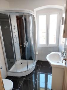 a bathroom with a shower and a sink at Apartments Ivana in Trogir