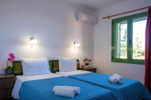 Ένα ή περισσότερα κρεβάτια σε δωμάτιο στο Villa Jokasta & Erato +64 φωτογραφίες