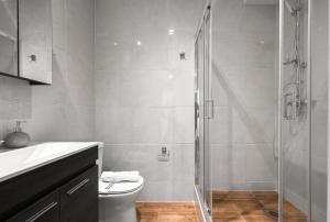 a bathroom with a shower and a toilet at Ipanema, Nilie Hospitality MGMT in Thessaloniki