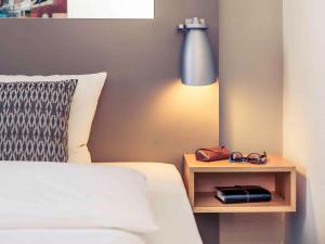 Postel nebo postele na pokoji v ubytování Mercure Hotel Düsseldorf City Nord