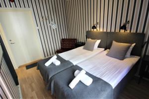 Postel nebo postele na pokoji v ubytování Vattengrändens Vandrarhem & Hotel