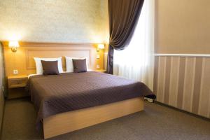 Postel nebo postele na pokoji v ubytování Dvoryanskiy Hotel
