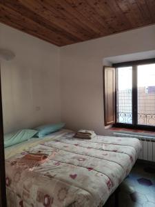 A bed or beds in a room at Il ristoro del viandante