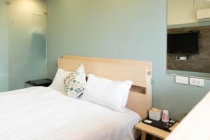 Katil atau katil-katil dalam bilik di Cen Pin B&B