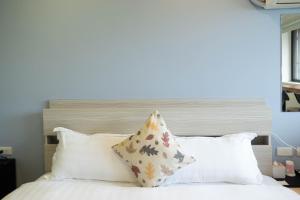 Katil atau katil-katil dalam bilik di Cen Pin B&B