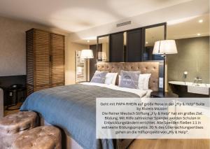 Postel nebo postele na pokoji v ubytování PAPA RHEIN - Hotel & Spa