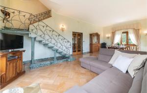 a living room with a couch and a staircase at Amazing Home In Camaiore lu With Wifi in Camaiore