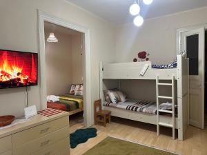 a bedroom with a bunk bed with a fire in it at Nelly Guesthouse in Istanbul