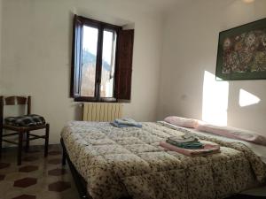 A bed or beds in a room at Il ristoro del viandante