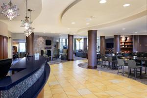 a lobby of a hotel with tables and chairs at Courtyard Bethlehem Lehigh Valley/I-78 in Bethlehem