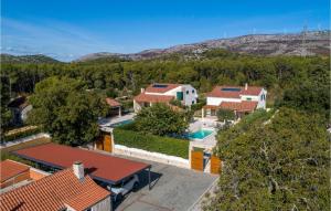an aerial view of a house with a swimming pool at Lovely Home In Sibenik With Wifi in Šibenik
