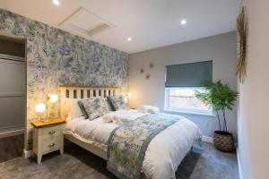 a bedroom with a bed and a window at Minerva House in Pocklington